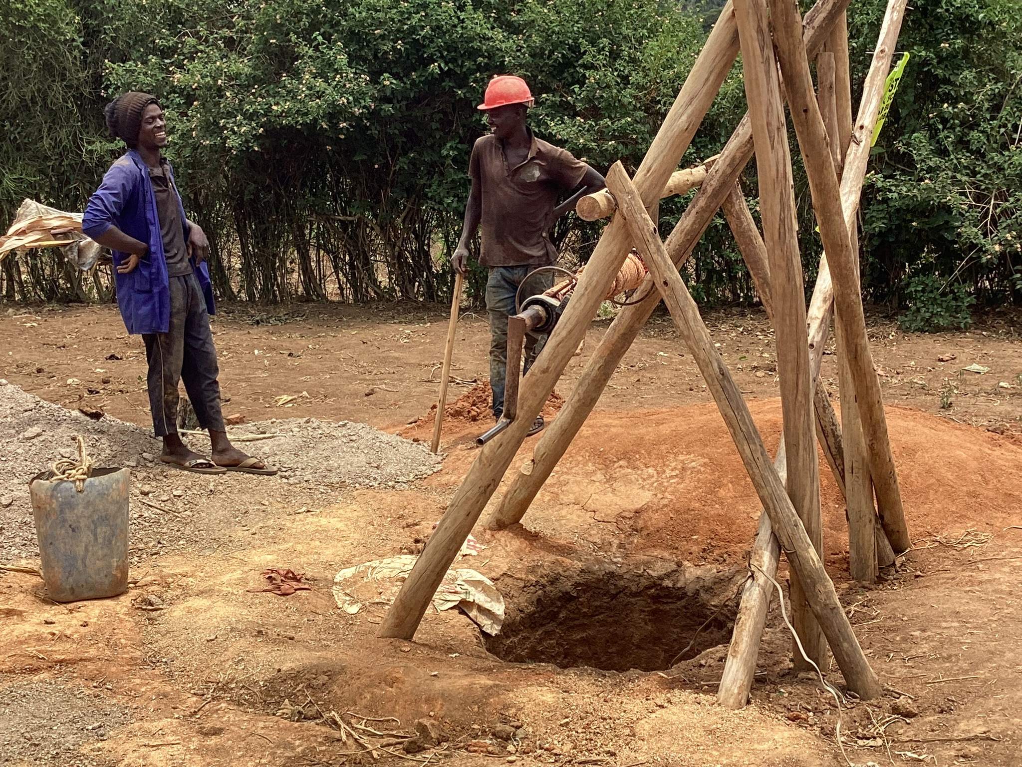 Workers preparing a site for a community water project.